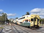 Bombardier Bilevel Cab Car # 2001 bringing up the back of Sunrail Train # P322 as it leaves WPK Station behind